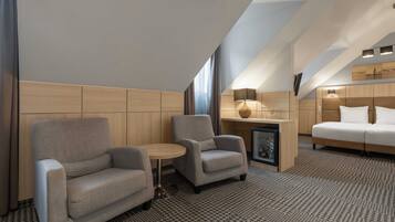 Colchones con pillow-top, minibar y caja de seguridad en la habitación