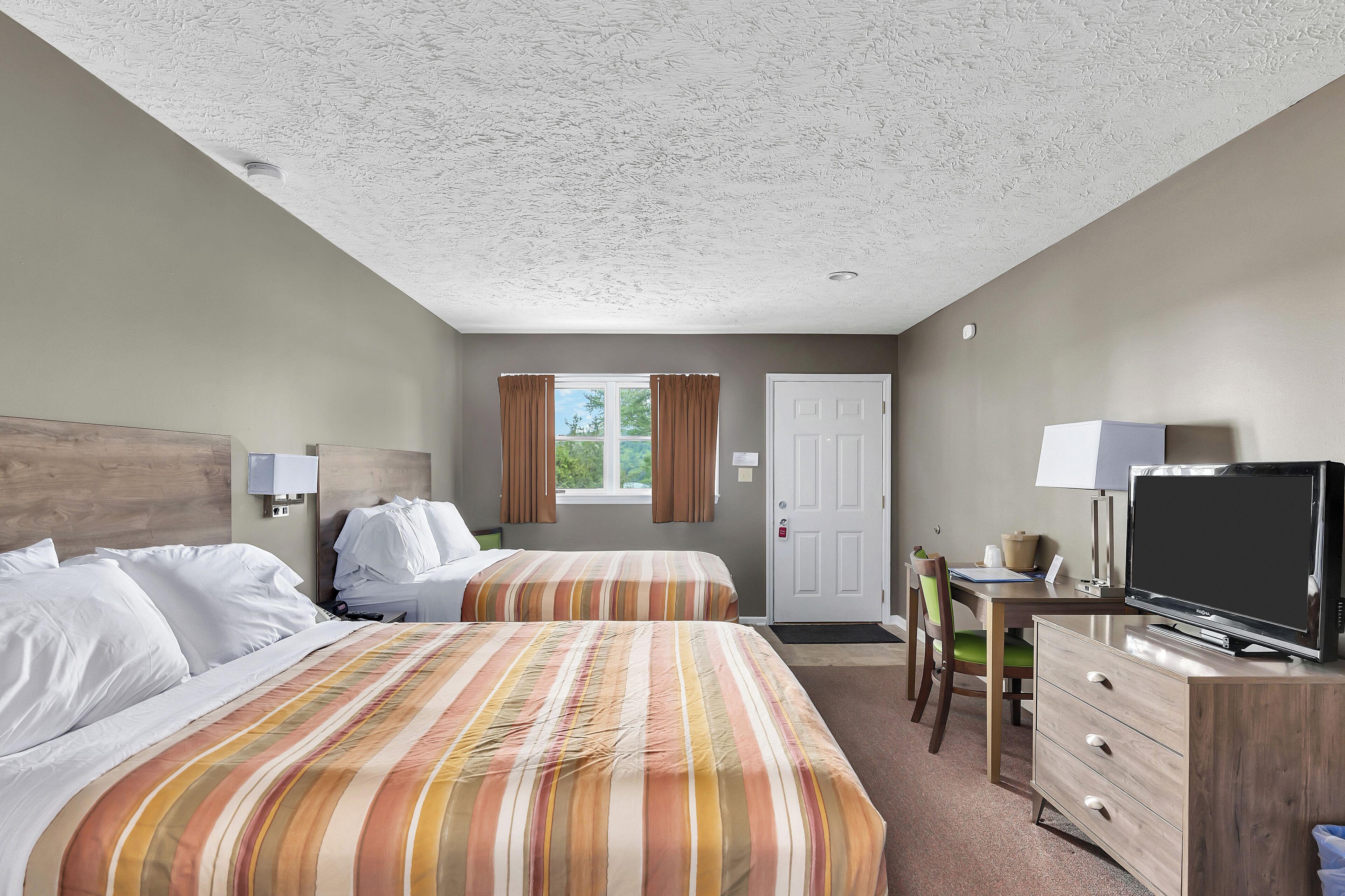 Standard Room, 2 Queen Beds, Refrigerator & Microwave, Ground Floor | Iron/ironing board, cots/infant beds, free WiFi, bed sheets