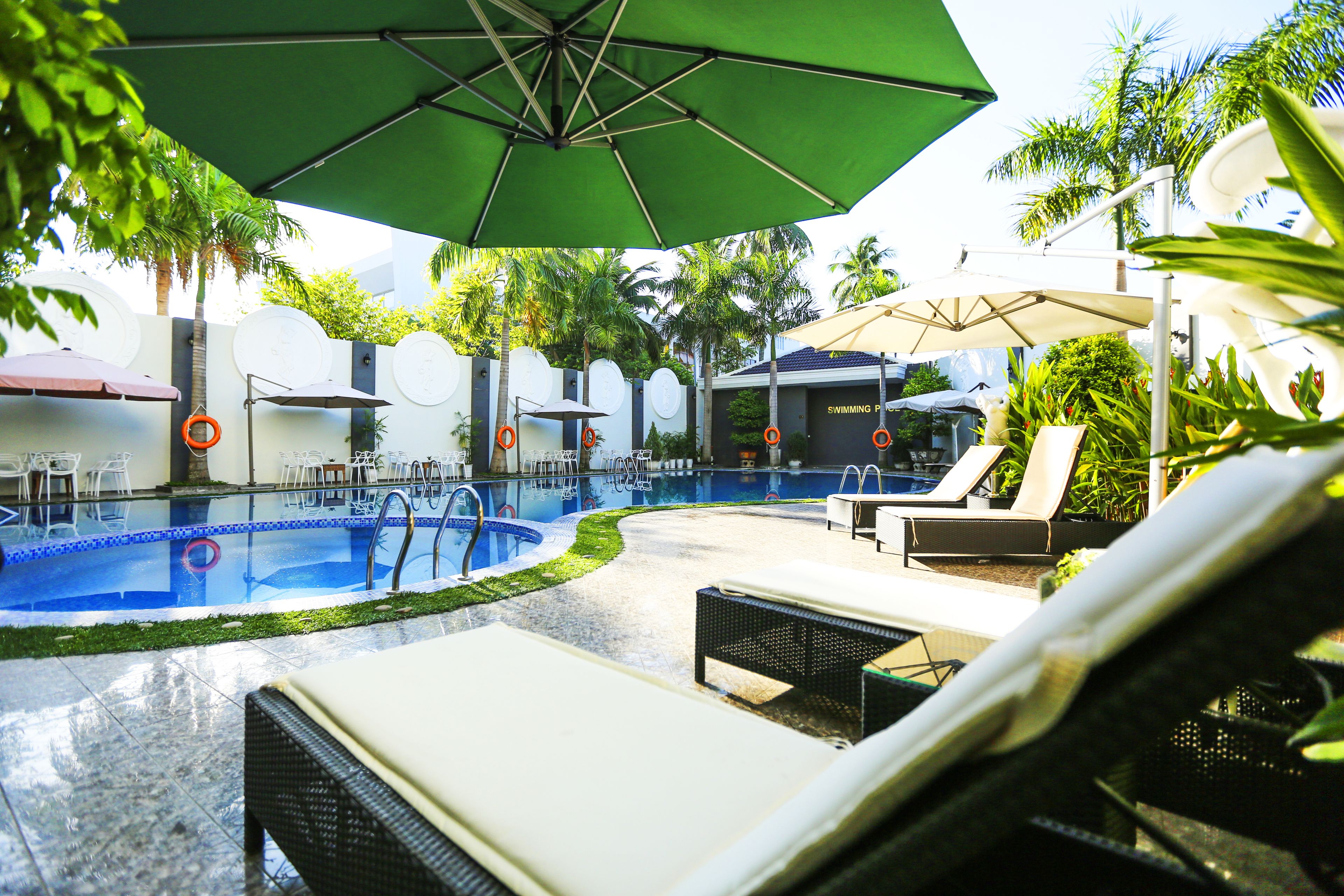outdoor pool, pool umbrellas, pool loungers