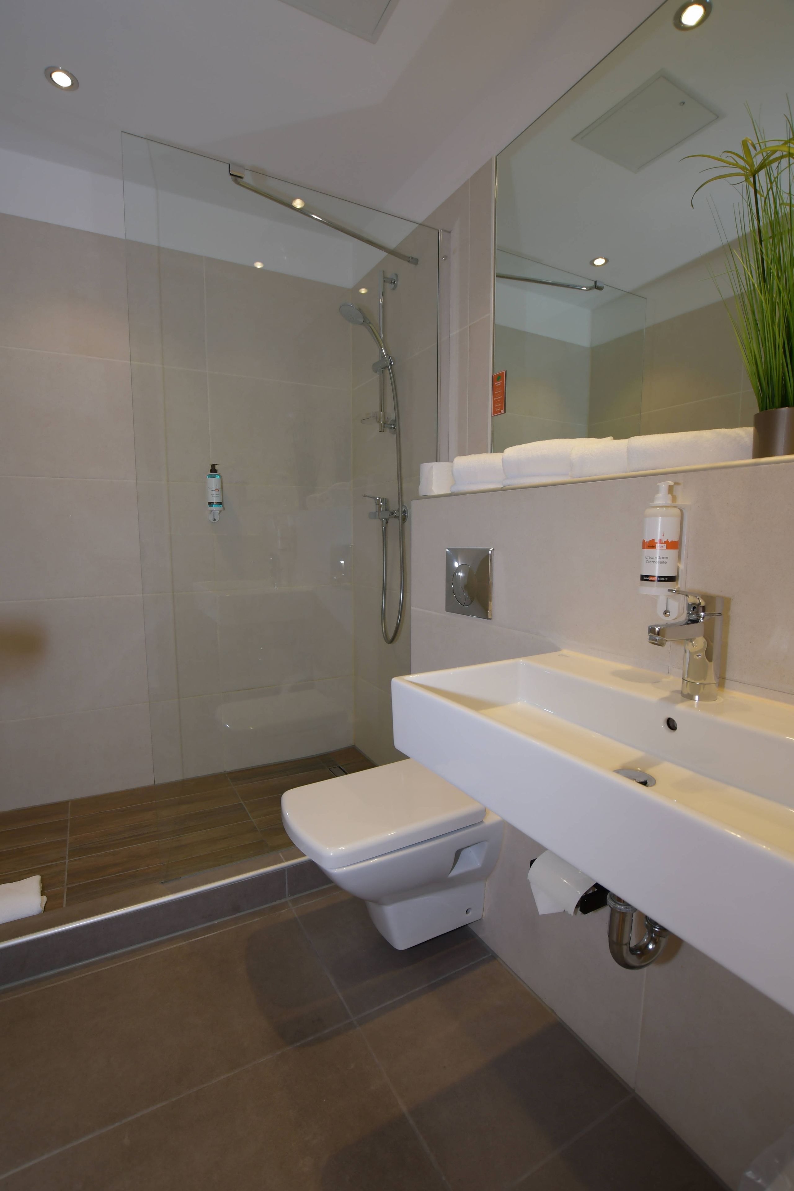 family room, allergy friendly | bathroom | shower, hair dryer, towels