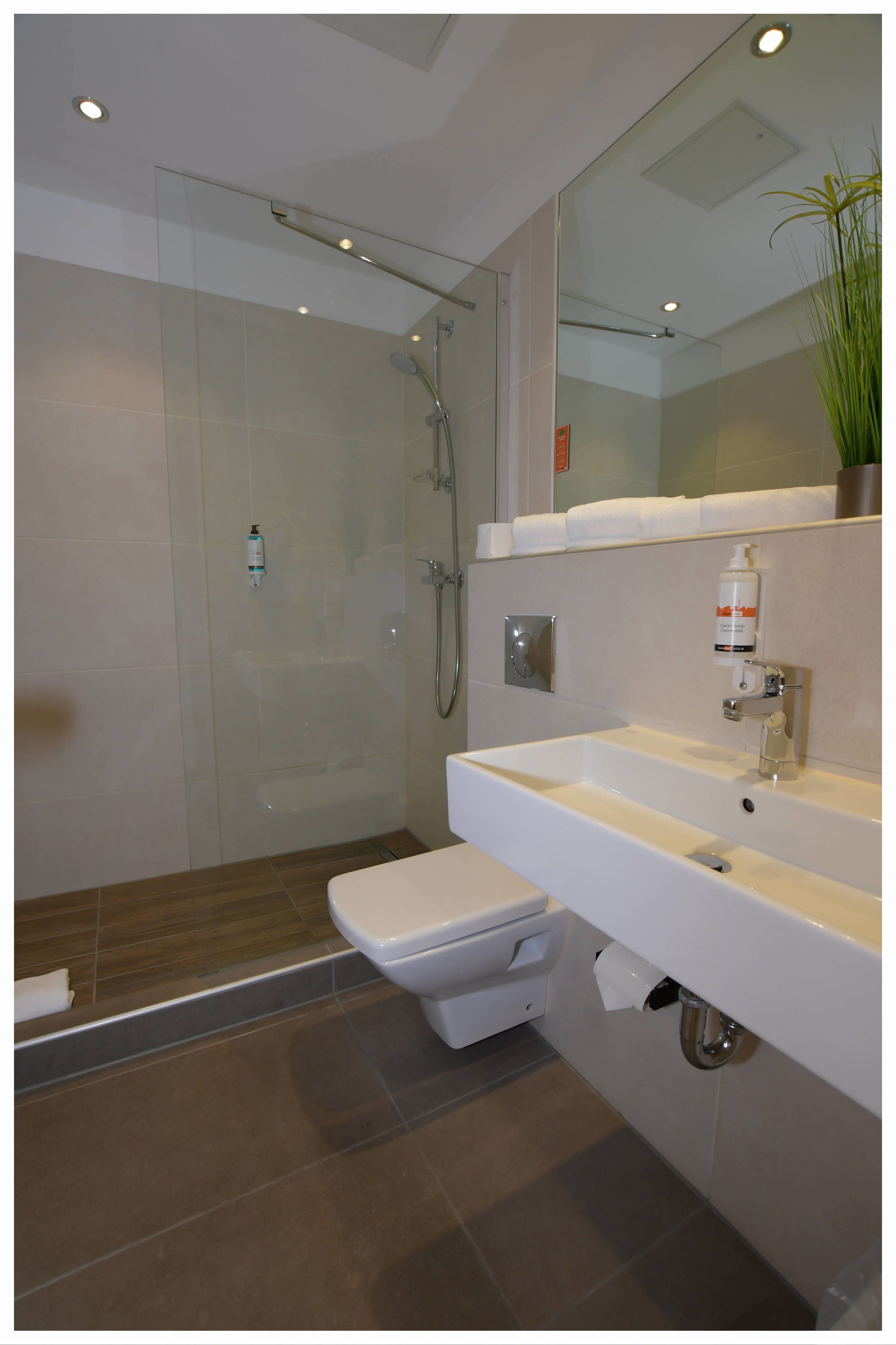 family room, allergy friendly | bathroom | shower, hair dryer, towels