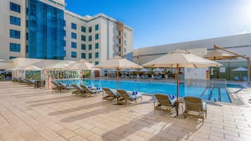 Outdoor pool, open 6:00 AM to 10:00 PM, pool umbrellas, sun loungers