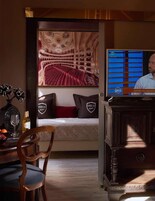 Deluxe Suite, Balcony | Down comforters, minibar, in-room safe, individually decorated