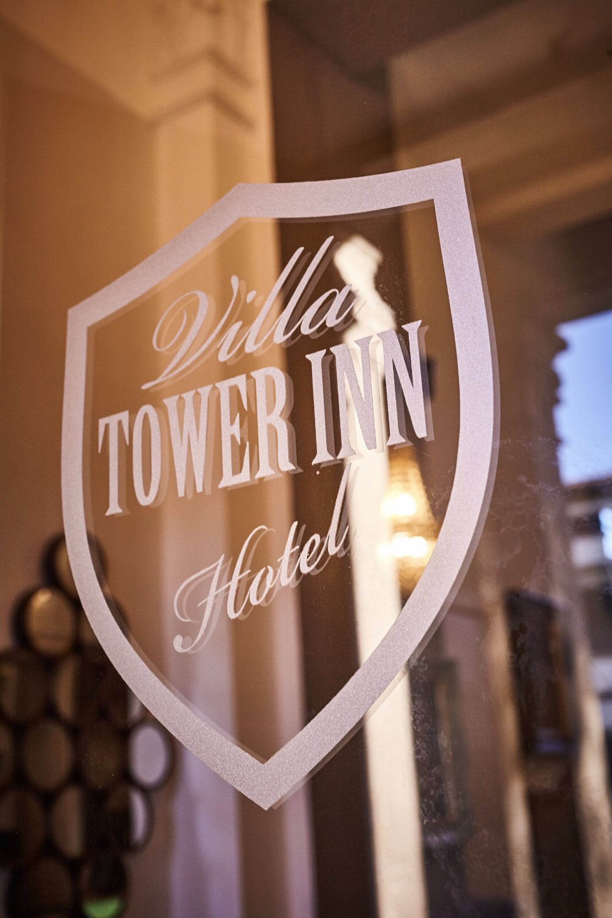 A sign with "Villa Tower Inn Hotel" written on it.