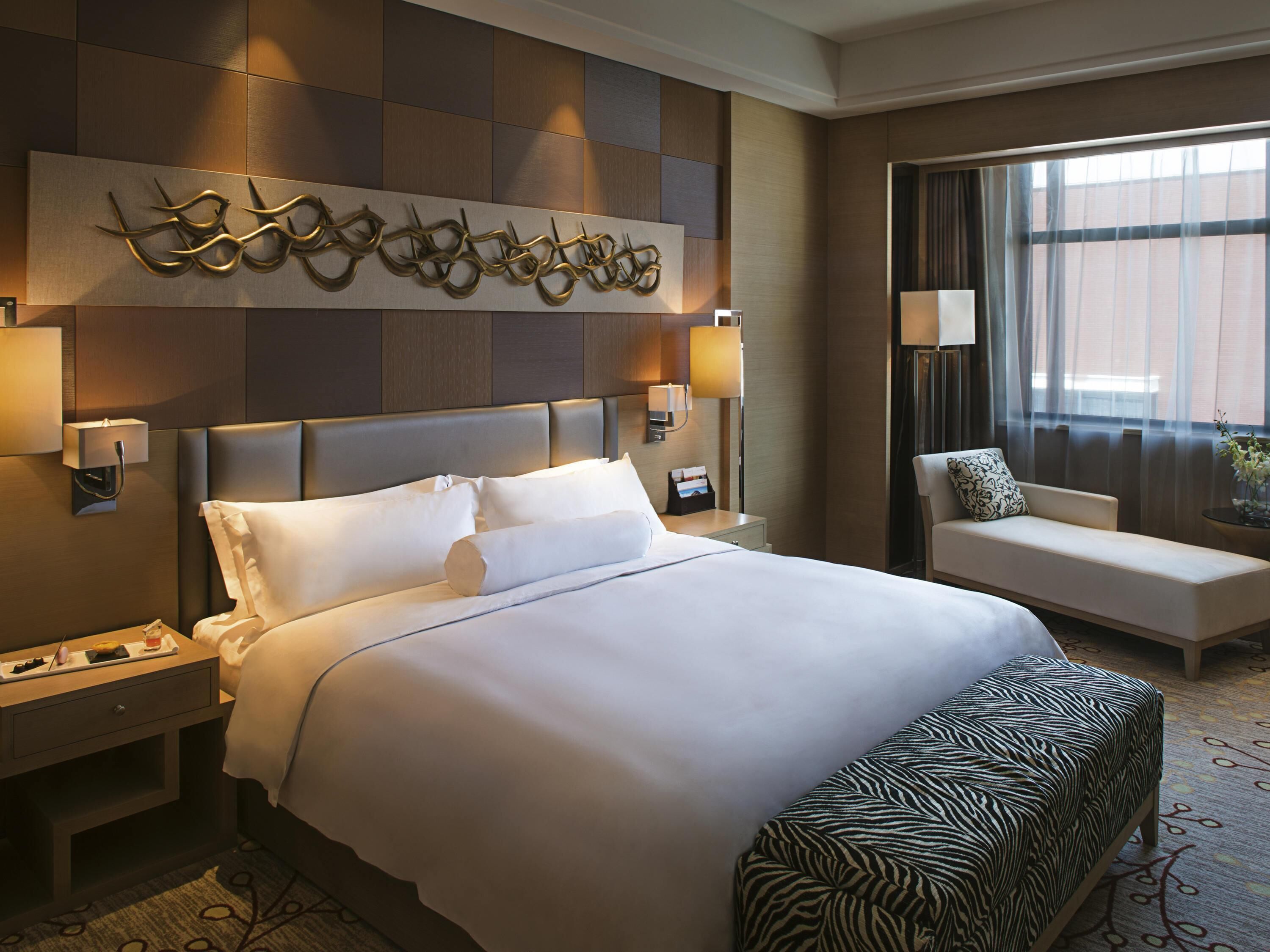 Premium bedding, down comforters, pillowtop beds, minibar