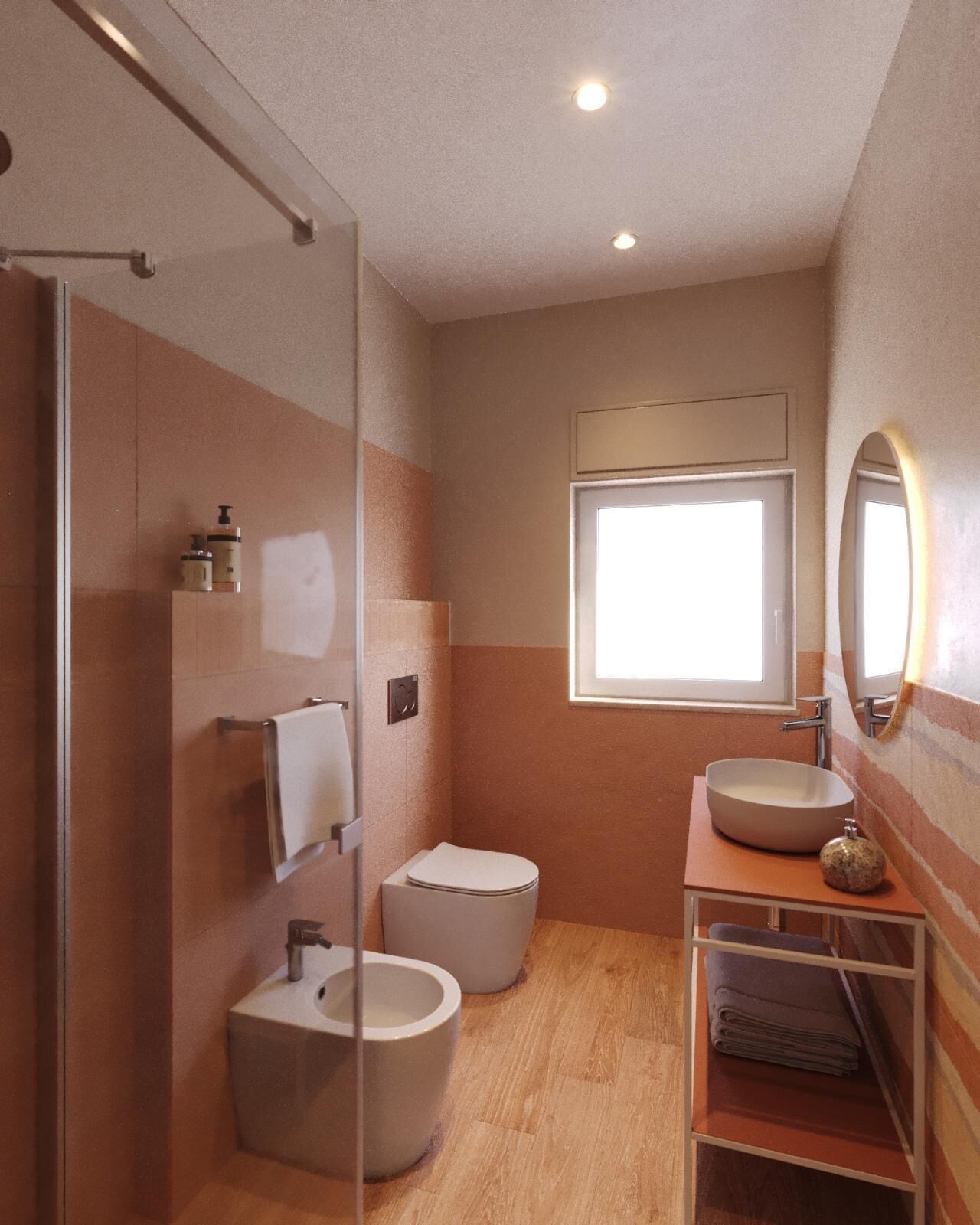 Un baño moderno con cabina de ducha de vidrio, inodoro, bidé y lavamanos con espejo.