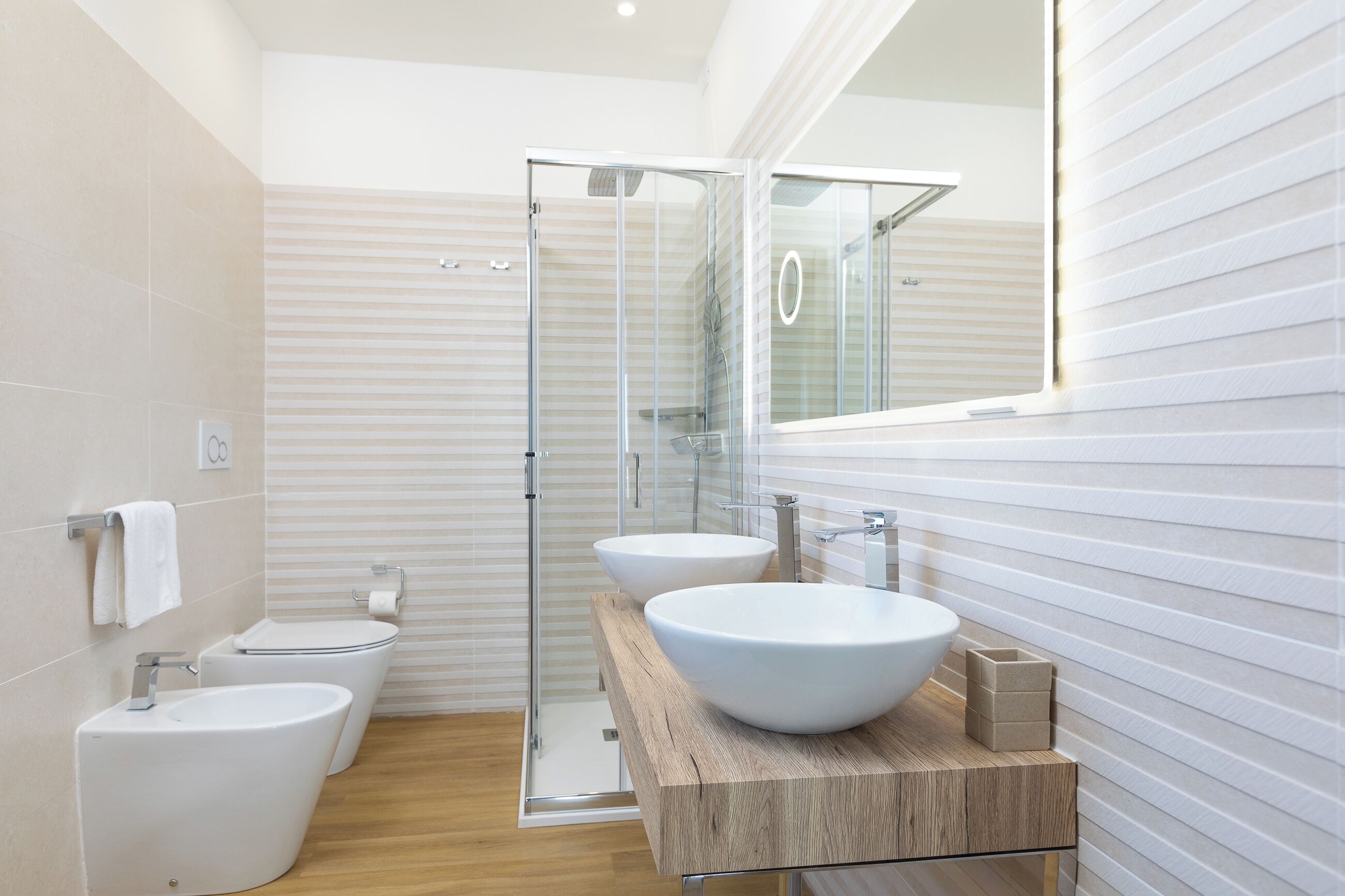 junior suite | bathroom | hair dryer, slippers, bidet, towels