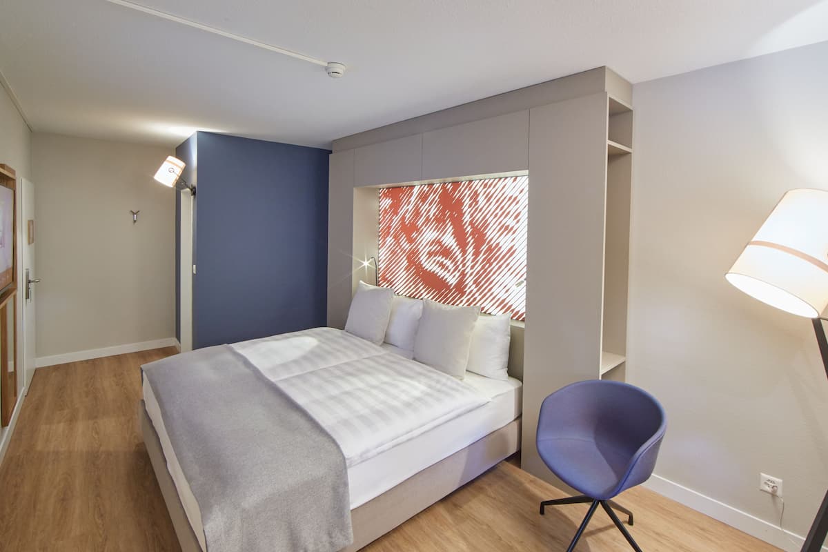 Premium bedding, down comforters, free minibar, in-room safe