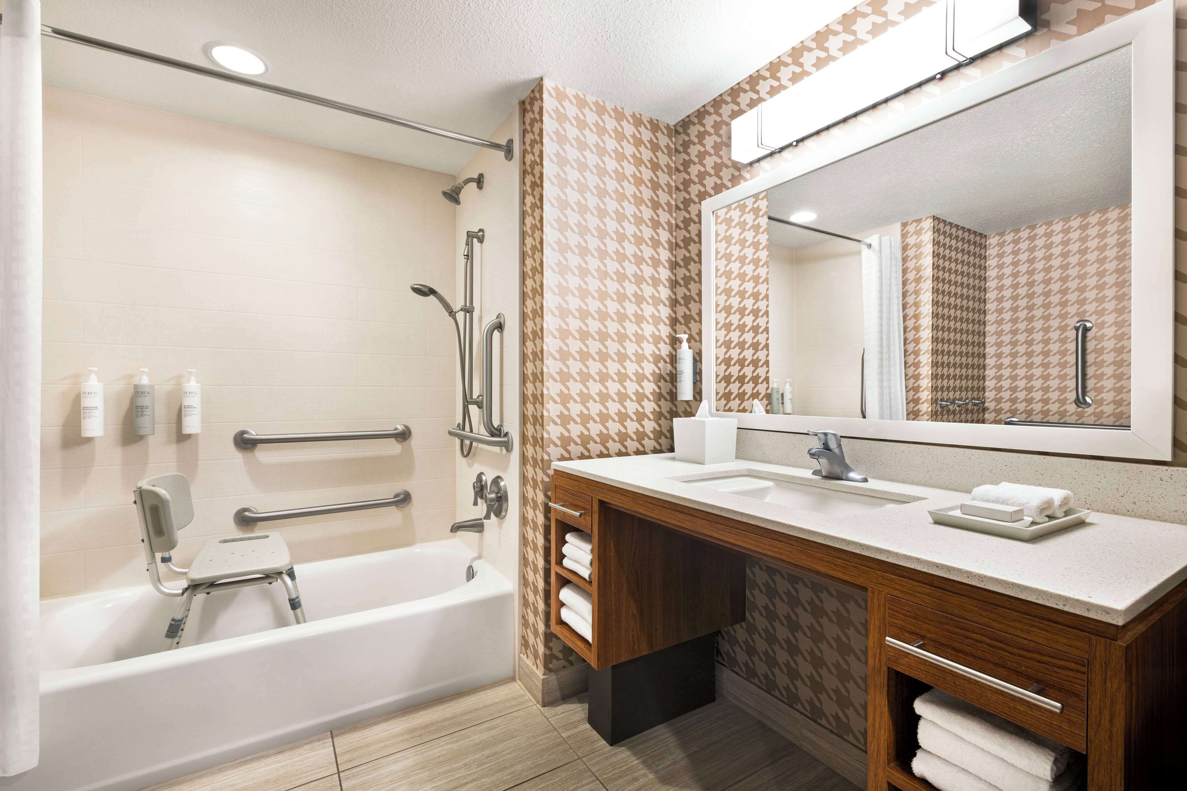 suite, 1 queen bed, accessible, bathtub | bathroom | combined shower/bathtub, free toiletries, hair dryer, towels