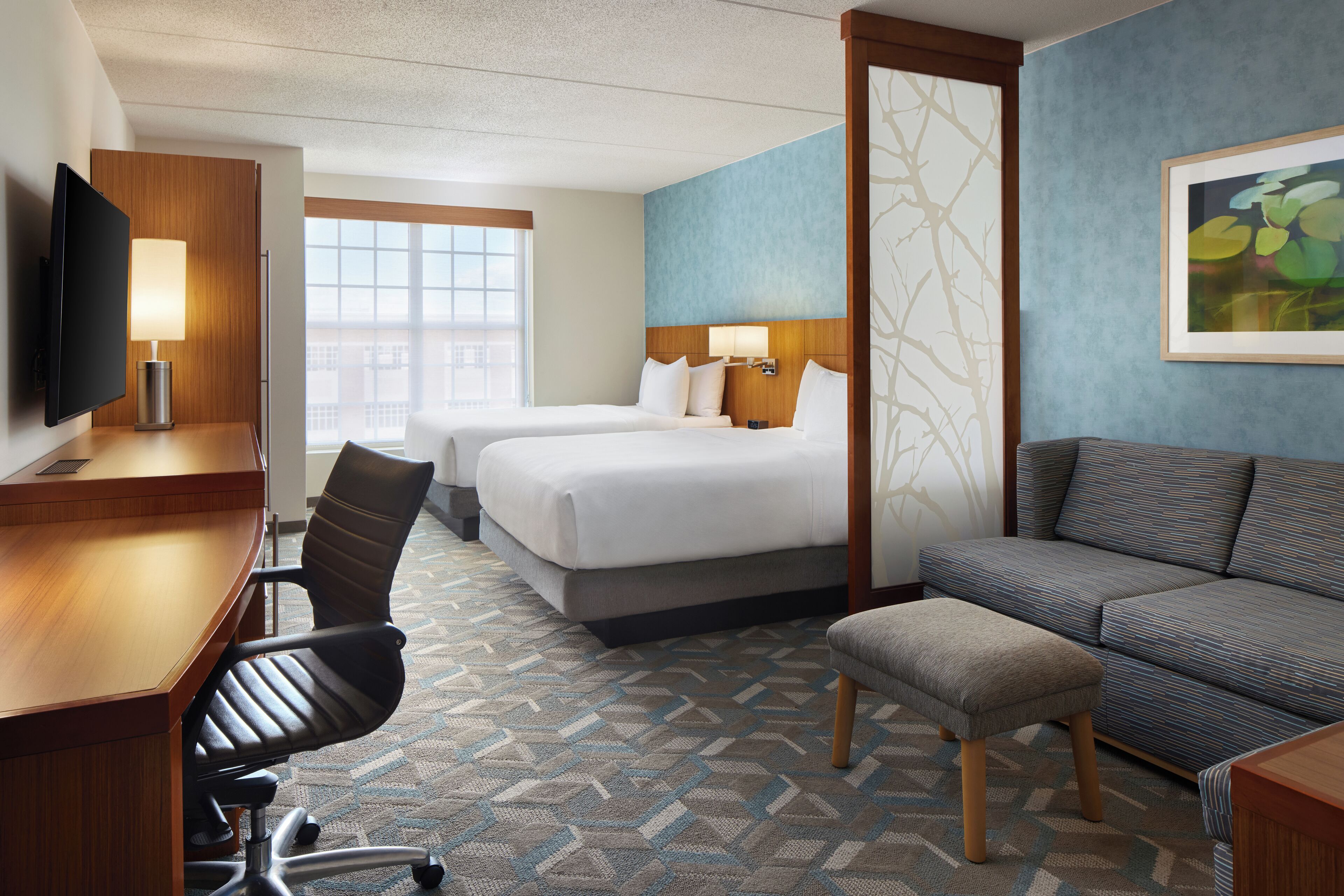 Premium bedding, desk, laptop workspace, blackout curtains