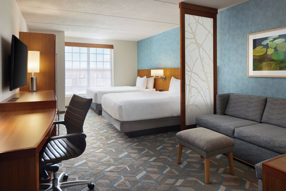 Premium bedding, desk, laptop workspace, blackout curtains
