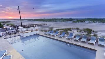 Seasonal outdoor pool, pool loungers