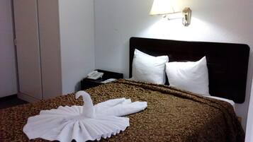 Hypo-allergenic bedding, down duvets, pillow-top beds, minibar