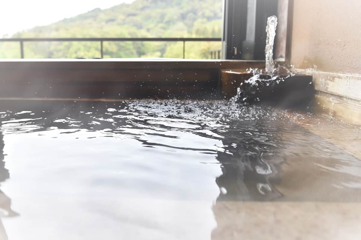 A water feature with a clear view of a mountainous landscape in the background.