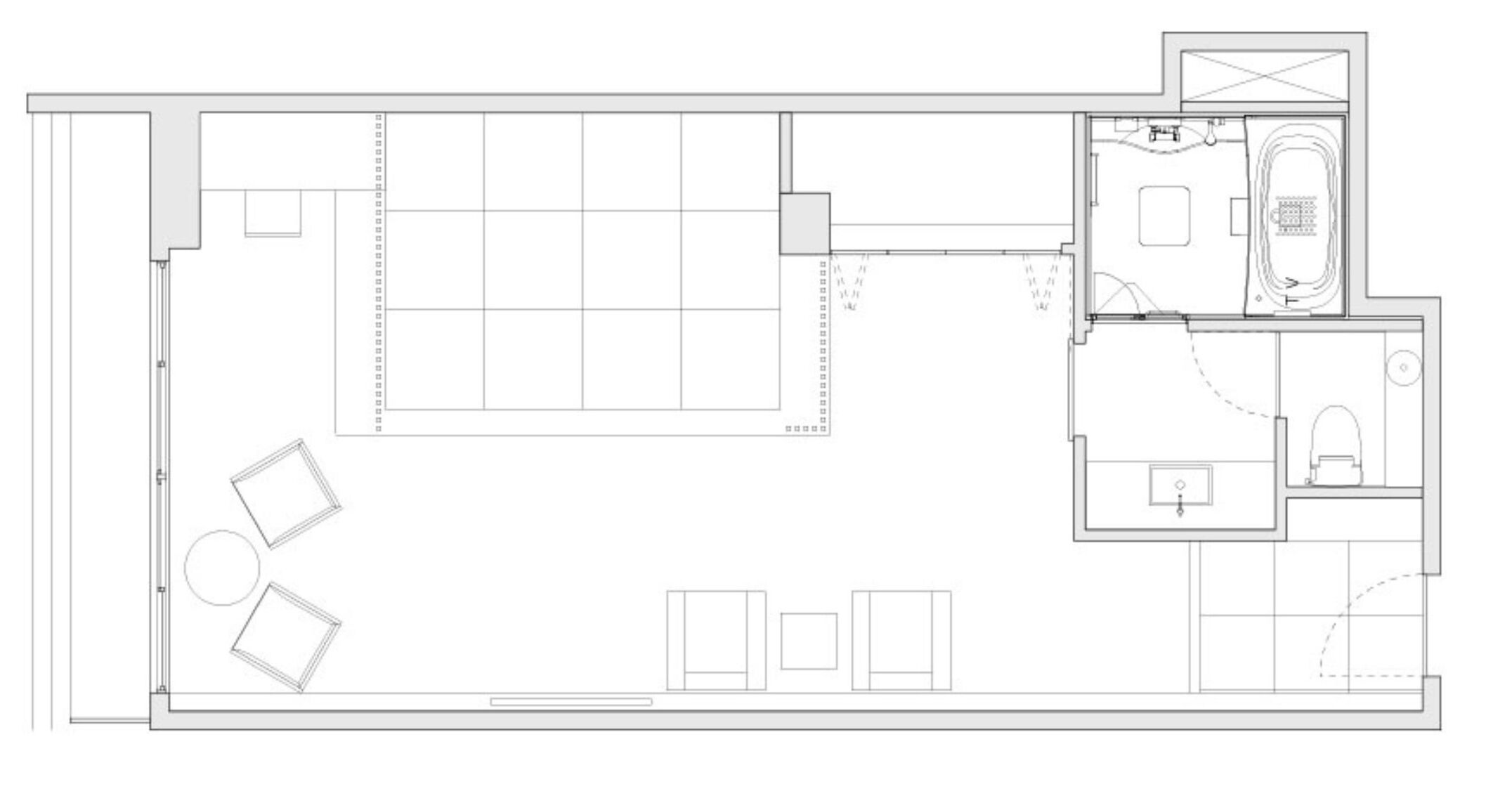 A floor plan with a large open space, a separate dining area, and a kitchen.
