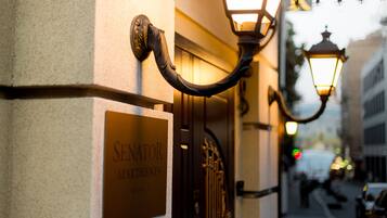 A building entrance with a sign reading "SENATOR APARTMENTS."