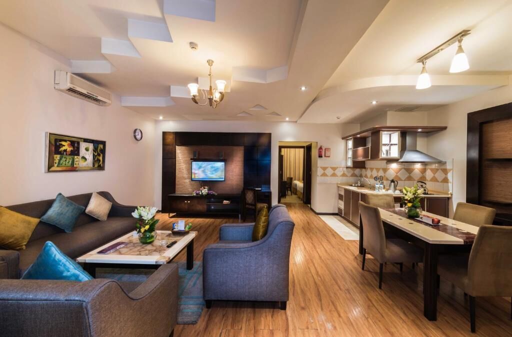 Suite, 3 Bedrooms | Living area | TV