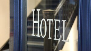 A hotel sign with the word "HOTEL" in large letters. - Hotel Hauser (Nuremberg)