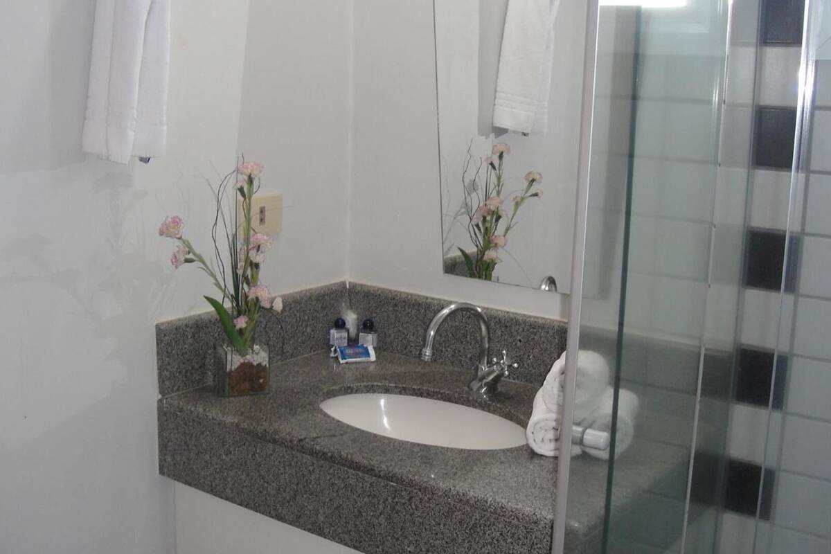 shower, rainfall showerhead, hair dryer, towels