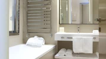 Junior Suite | Bathroom | Deep-soaking bathtub, rainfall showerhead, free toiletries, hair dryer
