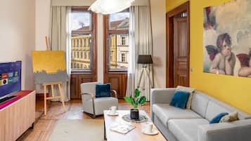 Two Bedroom Apartment with Balcony | Living area | 39-inch flat-screen TV with satellite channels, TV