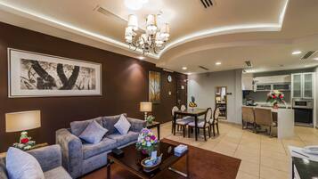 Suite Exécutive | Coin séjour | Télévision à écran plat