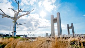 A modern architectural structure with a unique design, including a prominent H-shaped element, set against a backdrop of a clear sky and a grassy area. - ibis Styles Brest Centre Port (Brest)