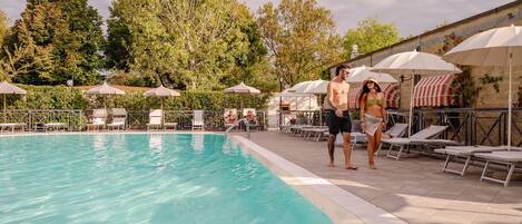 Seasonal outdoor pool, pool umbrellas, pool loungers