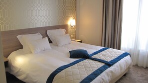Ropa de cama de alta calidad, minibar, escritorio y cortinas blackout 