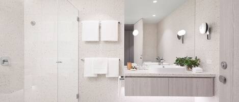 A modern bathroom with a glass shower enclosure, a wooden vanity, and a large mirror.