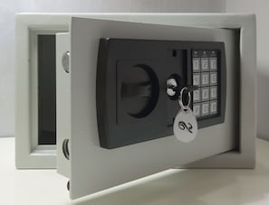 A safe with a keypad lock and a key. - Residenza Sistina (Rome)