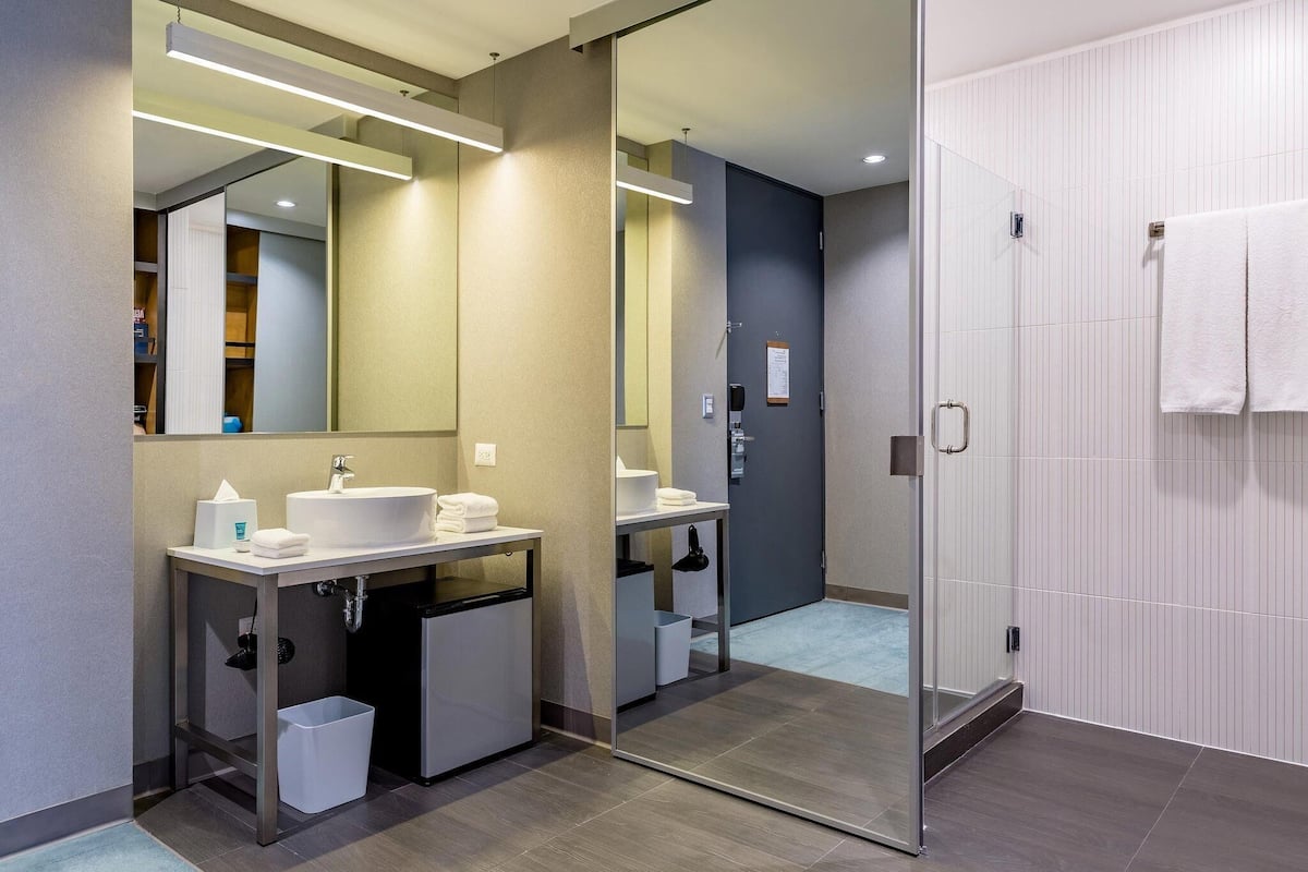 Bathroom | Shower, hydromassage showerhead, designer toiletries, hair dryer