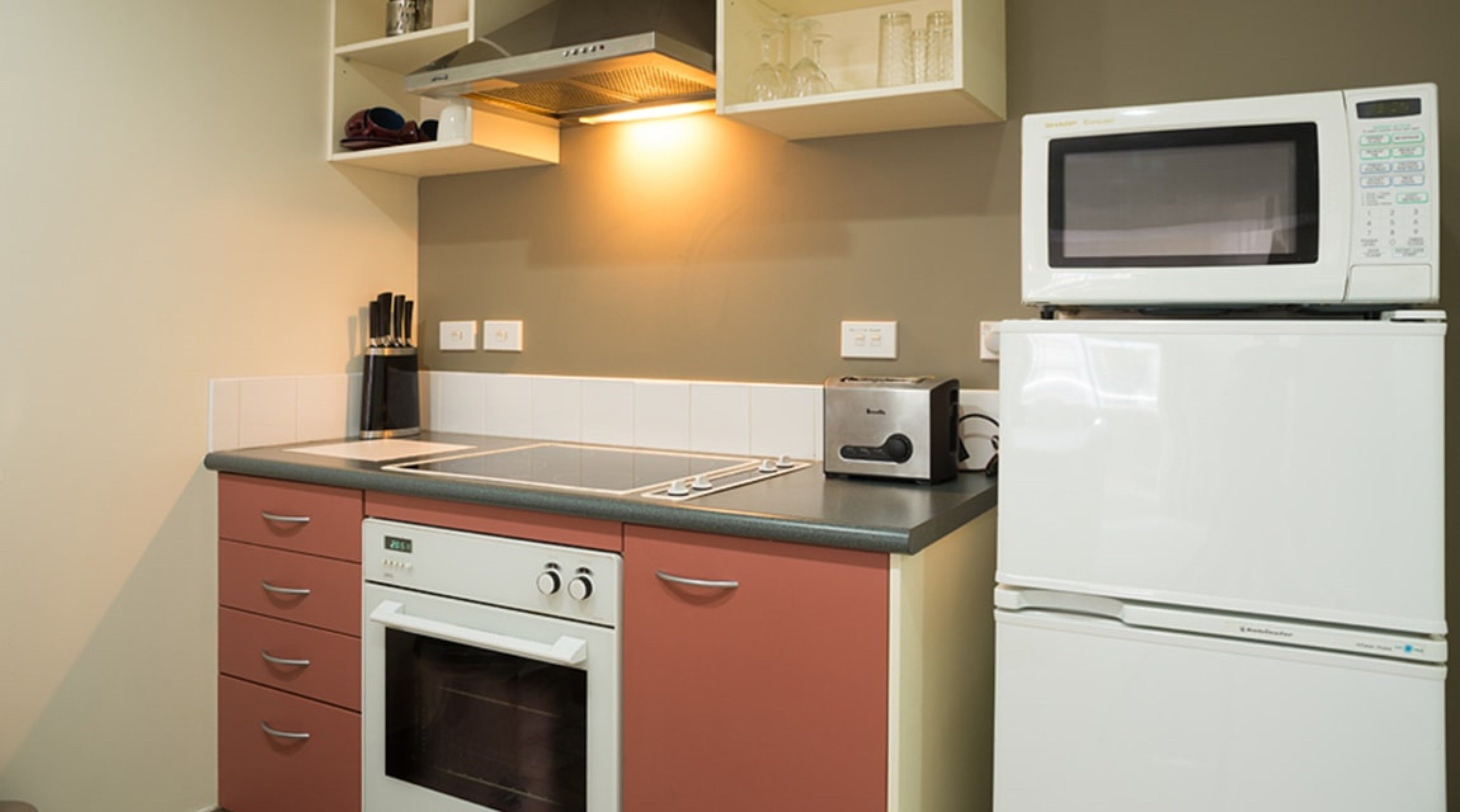 full-sized fridge, microwave, oven, stovetop