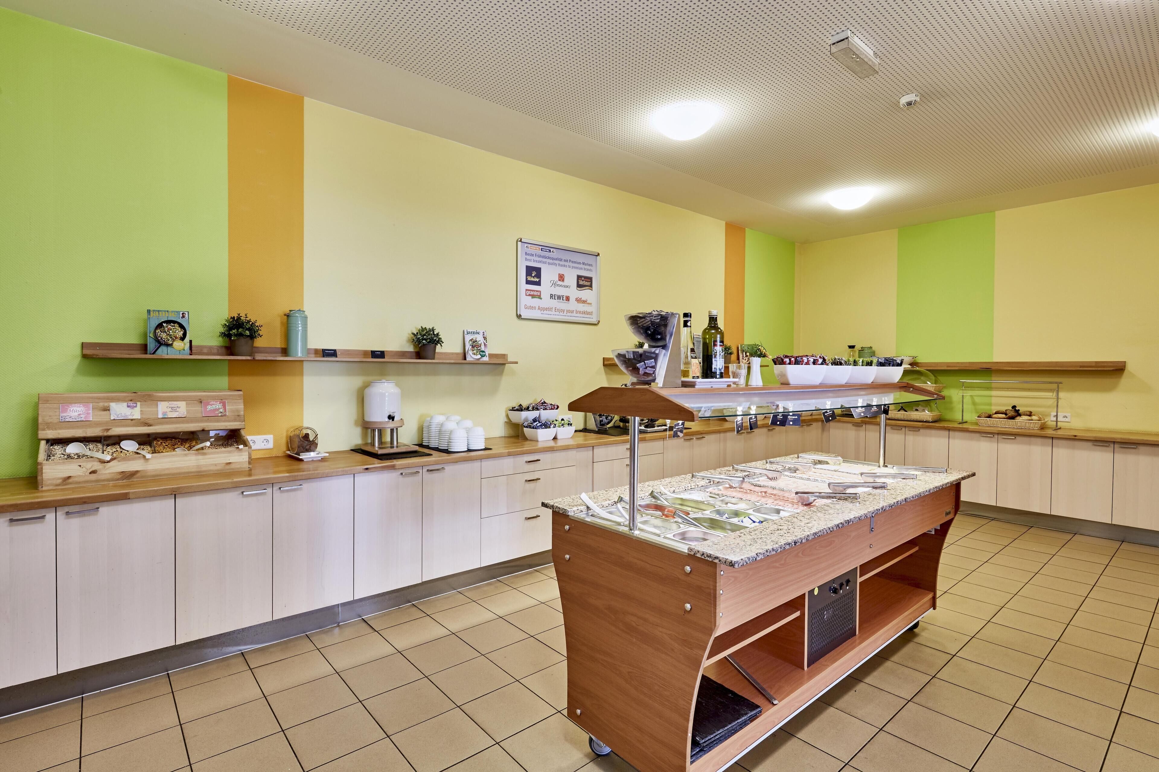 A buffet setup with a variety of food items and a sign above it.