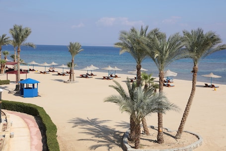 Private beach, beach umbrellas, beach towels, beach volleyball