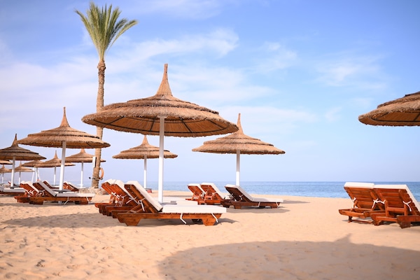 Private beach, beach umbrellas, beach towels, beach volleyball