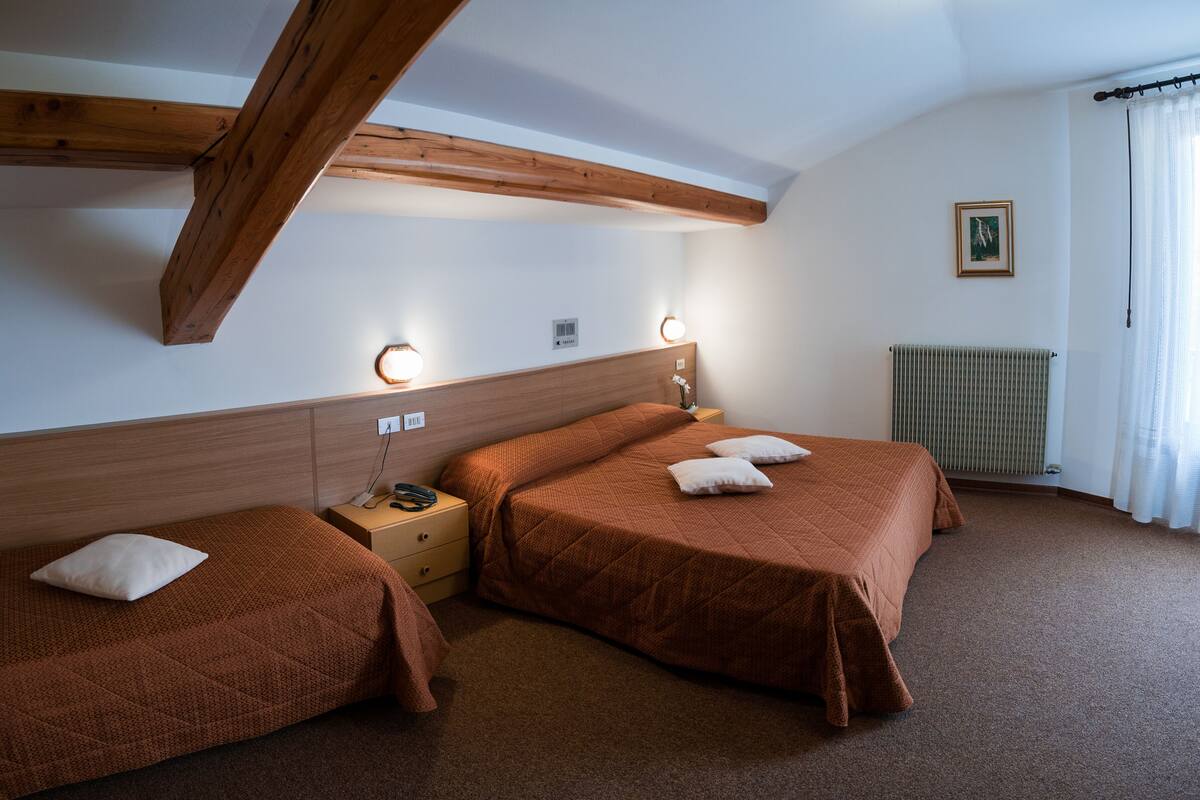 Standard Triple Room | In-room safe, desk, laptop workspace, blackout drapes