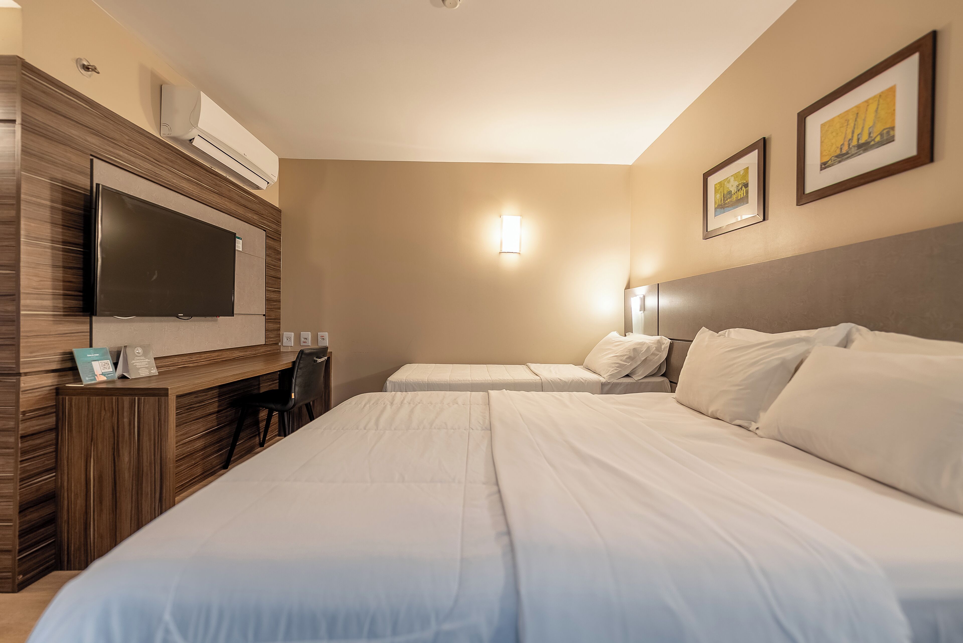 deluxe triple room | in-room safe, desk, laptop workspace, blackout curtains