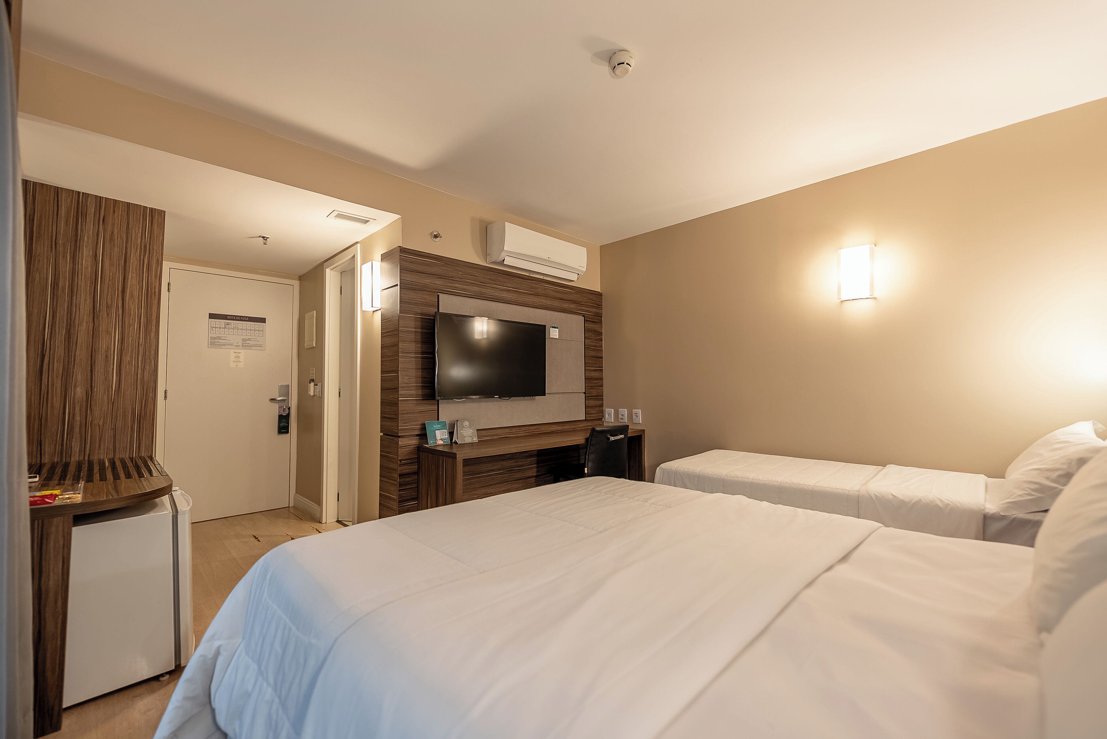 deluxe triple room | in-room safe, desk, laptop workspace, blackout curtains