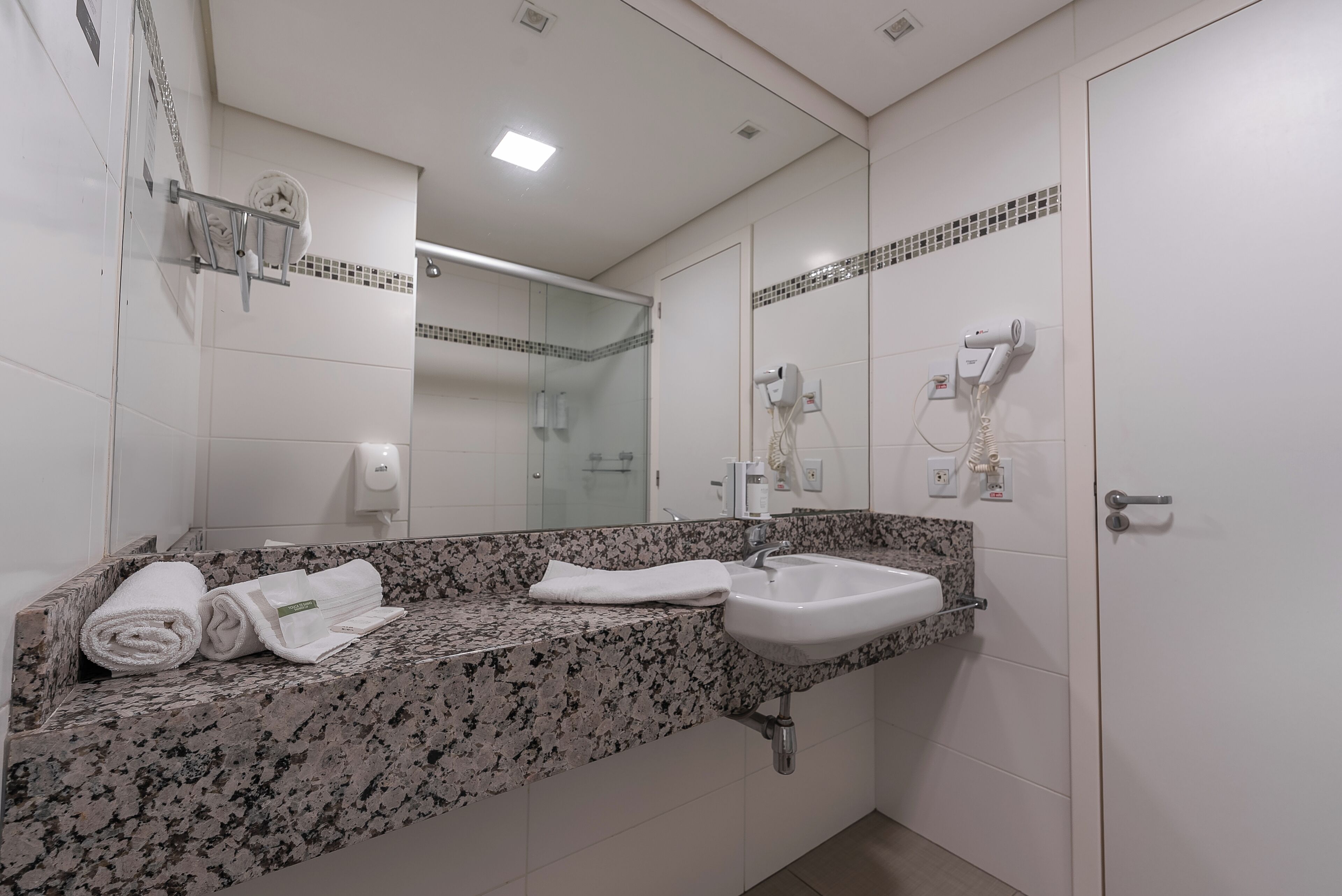superior double room | bathroom | shower, hair dryer, towels, soap