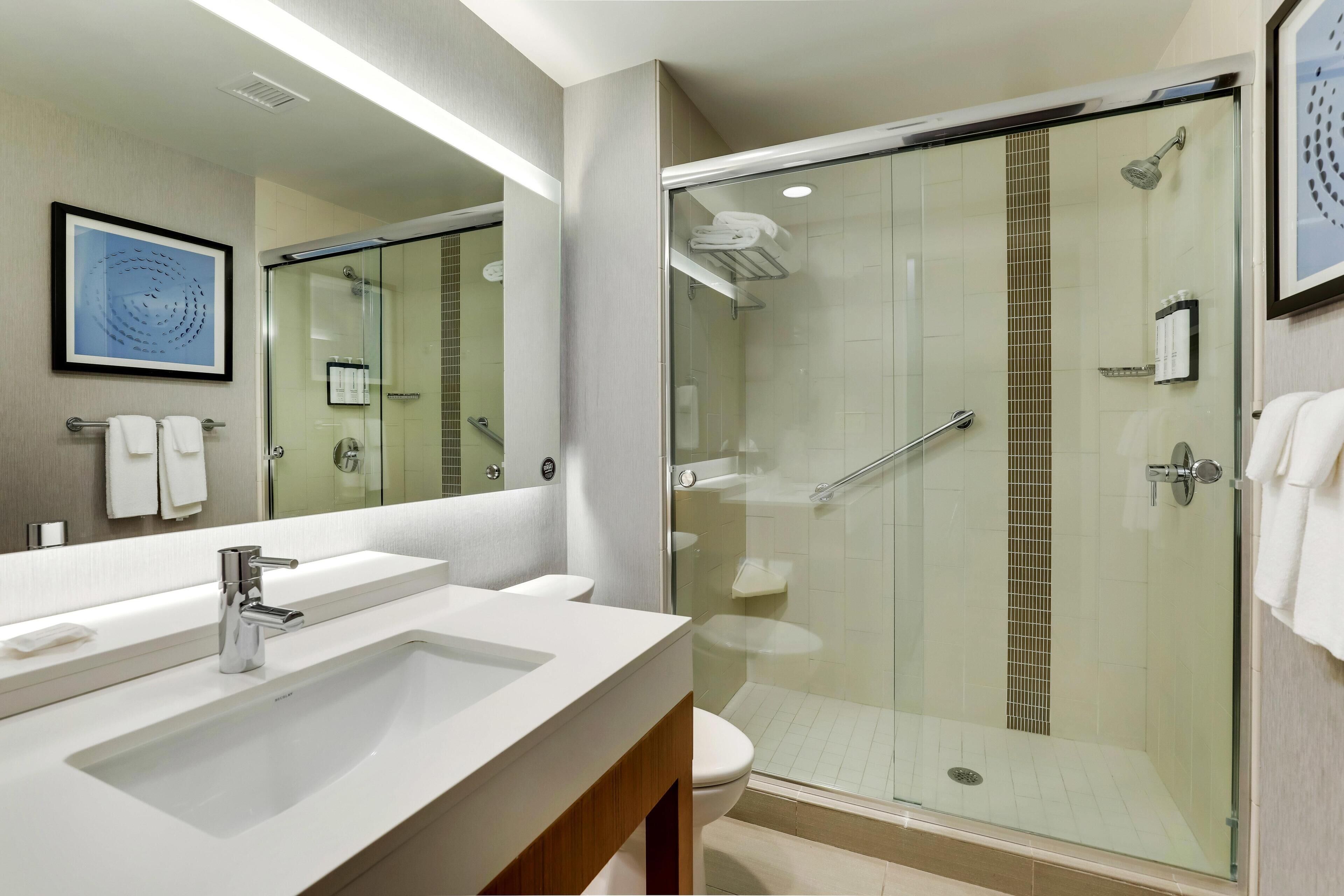 Designer toiletries, hair dryer, towels, soap