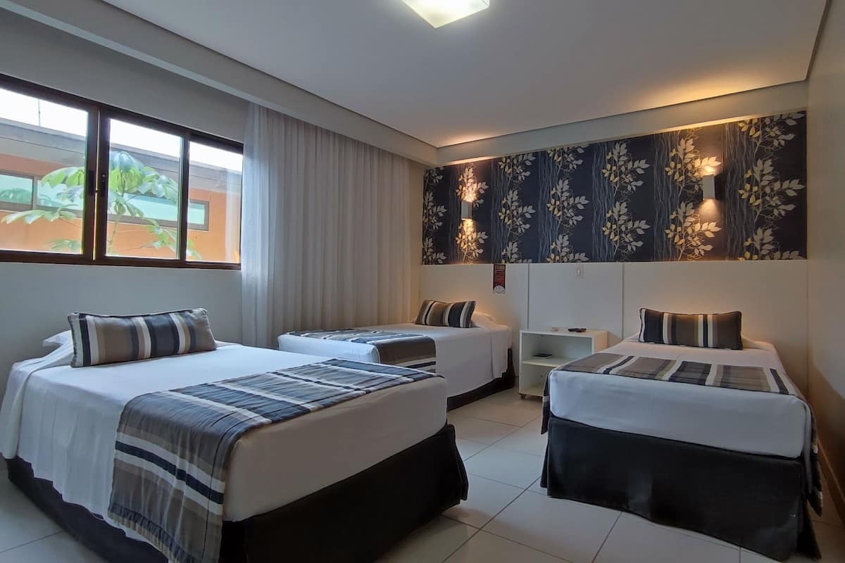 deluxe triple room | 2 bedrooms, minibar, in-room safe, desk