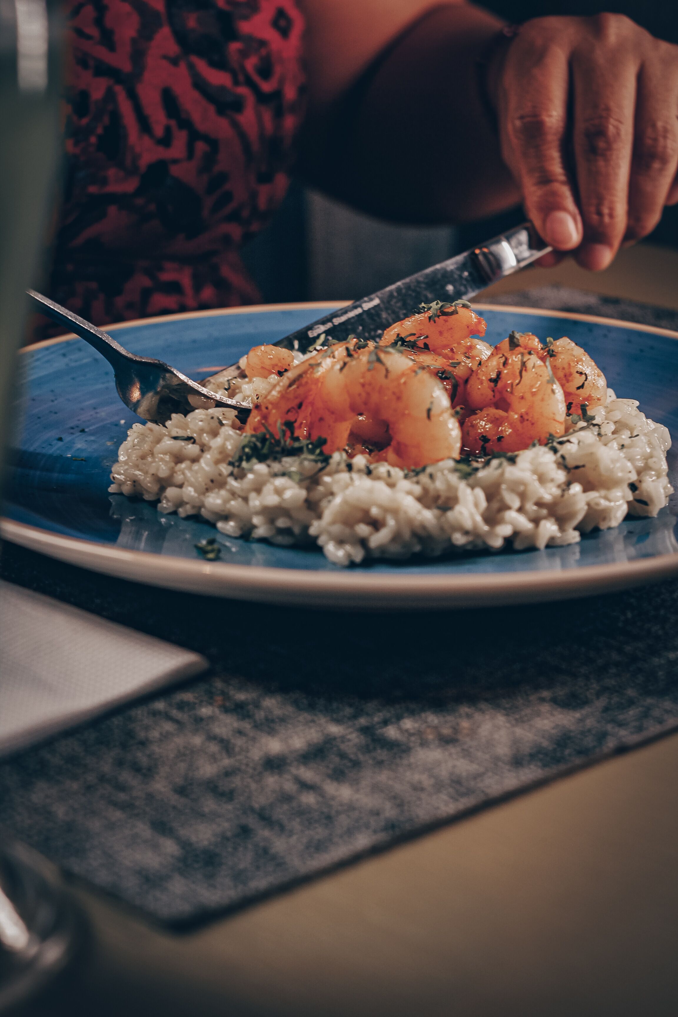 A plate of food with rice and shrimp.