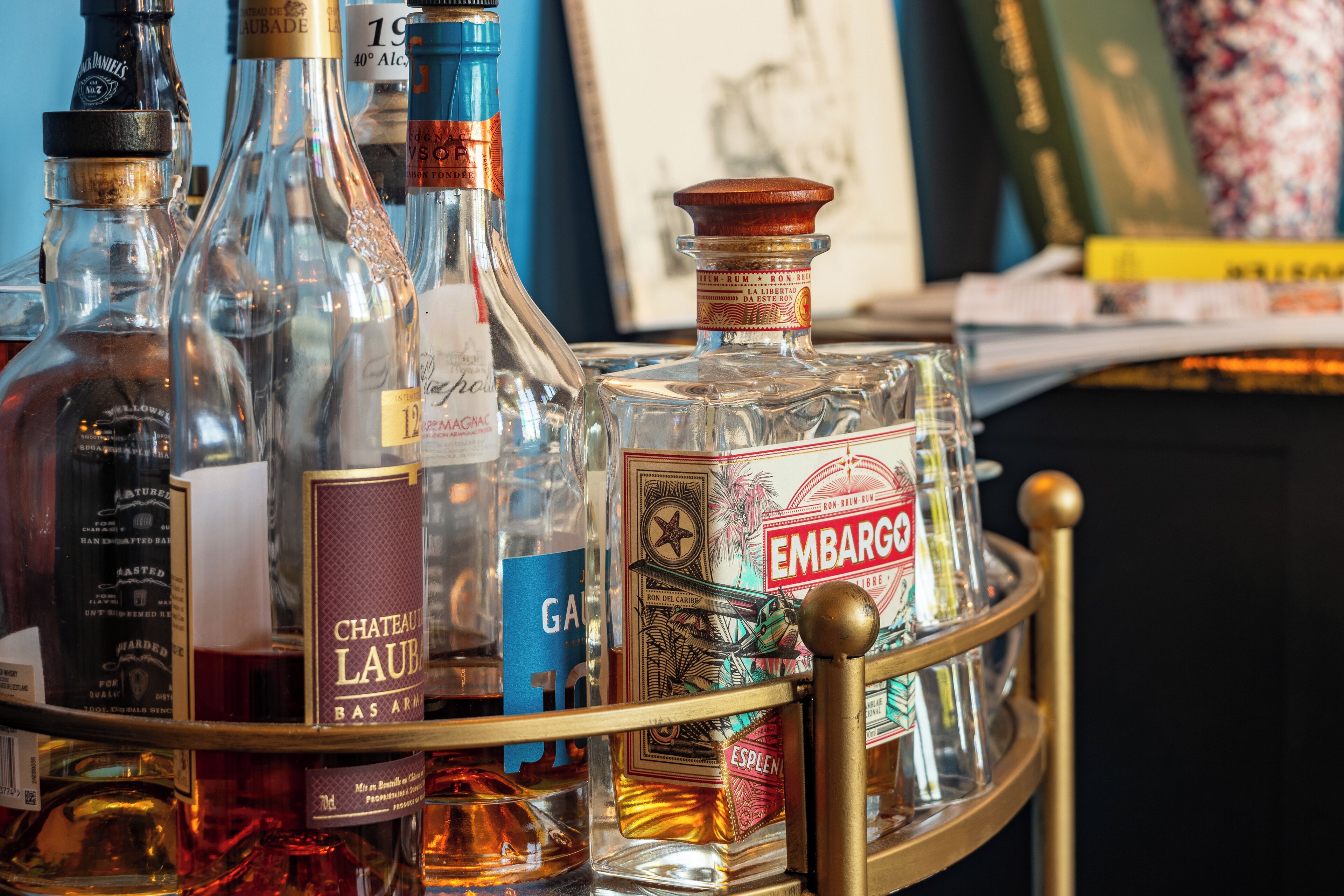 A collection of liquor bottles on a metal tray.