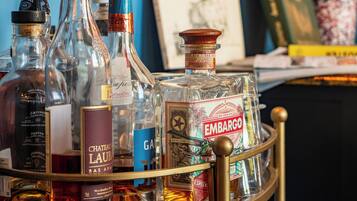 A collection of liquor bottles on a metal tray.
