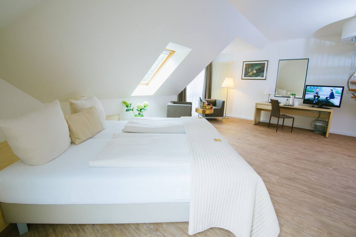 comfort double room | living area | flat-screen tv