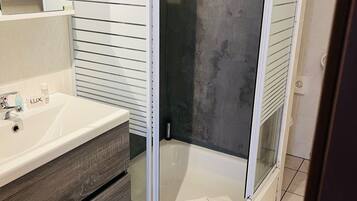 Shower, eco-friendly toiletries, hair dryer, towels