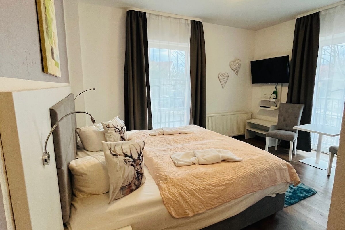 Desk, blackout curtains, free WiFi, bed sheets