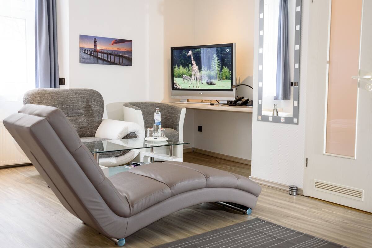 family room | 1 bedroom, in-room safe, desk, laptop workspace