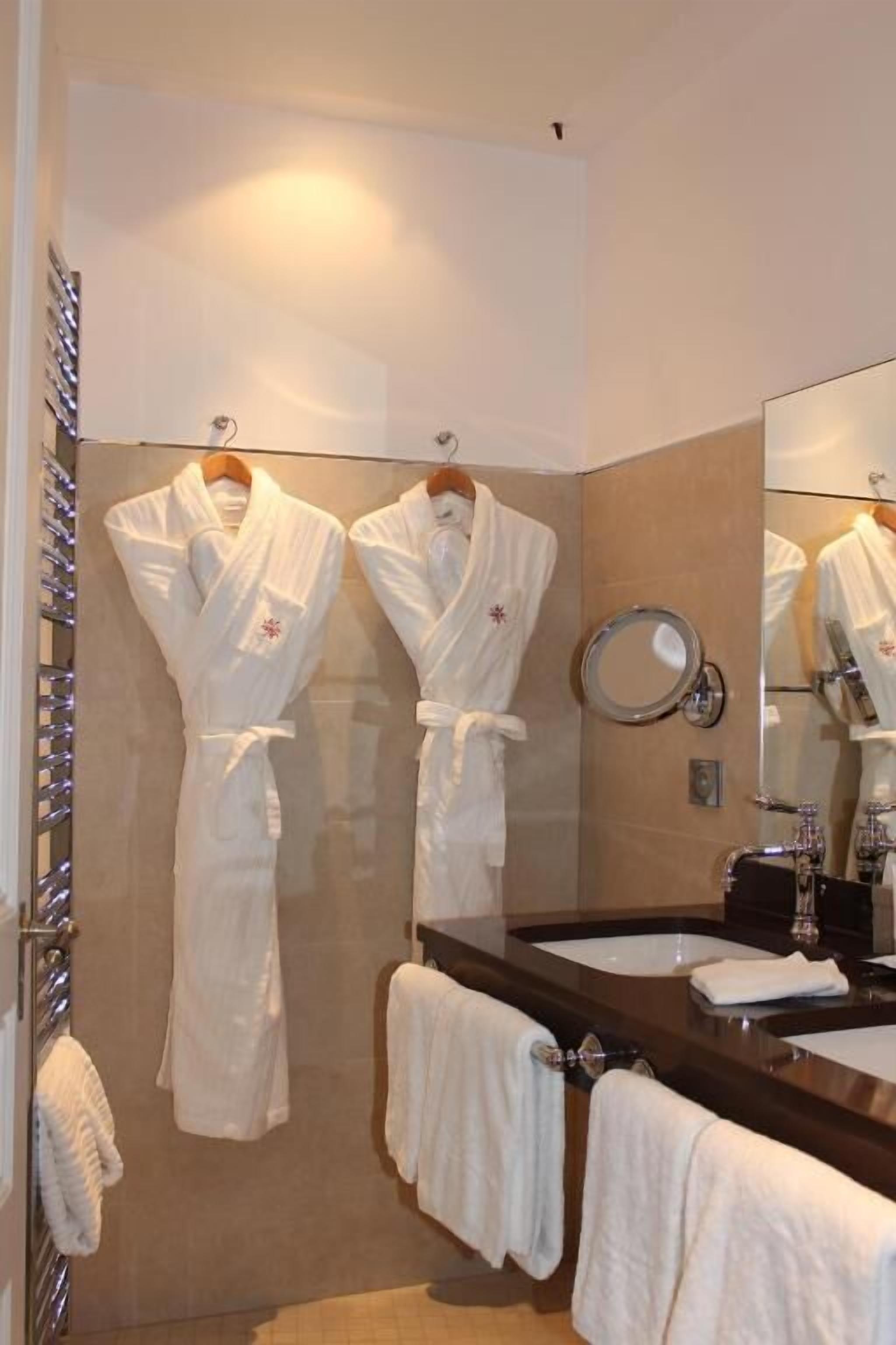 deluxe room | bathroom | hair dryer, bathrobes, slippers, towels